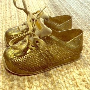 Mini Melissa gold sneakers